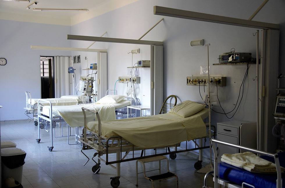 Three beds in a hospital emergency room.